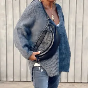 Casual loose chunky knit V-neck sweater for women, solid color slouchy long sleeve pullover top.