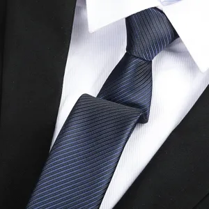 Detail view of classic navy blue striped necktie for men, professional business suit accessory.