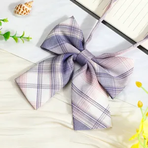 Close-up detail of the purple plaid JK uniform ribbon bow tie, fine fabric texture.