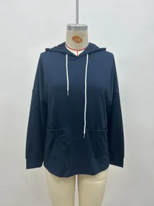 Close-up of dark blue waffle knit casual long-sleeve hooded sweatshirt with pockets.