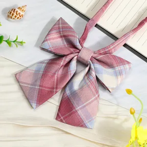 Close-up detail view of Japanese JK uniform plaid ribbon bow tie in pink and blue pattern.