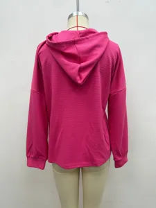 Back detail view of a pink waffle knit long sleeve casual hooded sweatshirt with relaxed fit.