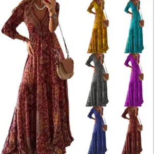 Bohemian geprinte lange mouw V-hals maxi jurk detail met elegante vloeiende rok.
