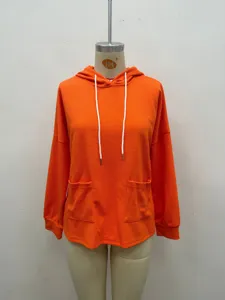 Vibrant orange waffle knit hoodie for women, casual long sleeve pullover with practical pockets.