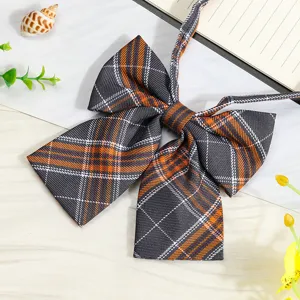 Detailed view of the JK Japanese plaid black bowtie with ribbons, perfect for school uniforms.