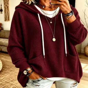 Casual waffle knit hooded sweatshirt for women, loose long sleeve pullover in wine red color.
