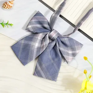 Detailed close-up of a Japanese JK style plaid bowtie, showing fabric texture and neat bow.