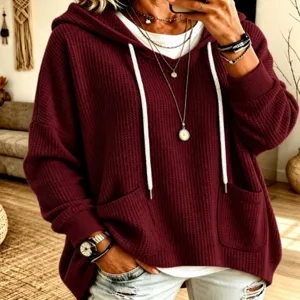 Casual waffle loose long sleeve hooded sweatshirt for women, comfortable daily wear top.