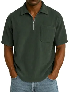 Dark green corduroy short sleeve zip polo shirt, textured fabric casual detail view.