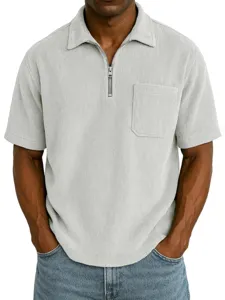 Men's corduroy zip polo shirt short sleeve detail view showing texture and metal zipper.