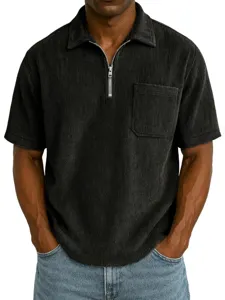 Close-up detail of men's short sleeve corduroy polo shirt featuring a front zipper and chest pocket.