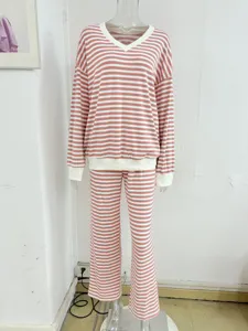 Casual pink and white striped v-neck long sleeve top and straight pants pajama set.