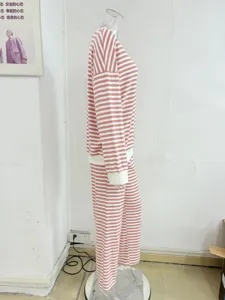 Pink and white striped loungewear set detail, long sleeve top and pants on mannequin display.