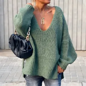 Detailed shot of the cozy V-neck loose knit sweater, highlighting the soft texture and fit.