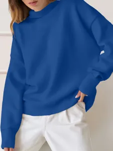 Close-up detail shot of a women's solid royal blue turtleneck sweatshirt, long sleeves.