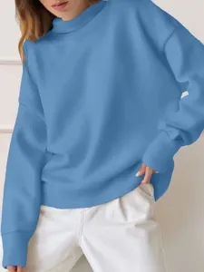 Detailed view of women's solid color blue long sleeve mock neck sweatshirt casual style.