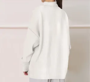 Back view of a women's solid white oversized turtleneck long sleeve sweatshirt for autumn.