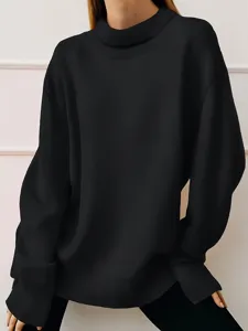 Detail shot of the solid black mock neck long sleeve sweatshirt, showing the upper body fit.