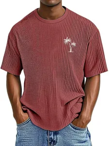 Men waffle knit short sleeve t-shirt with palm tree graphic detail, casual summer top.