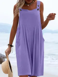 Detail view of the elegant purple sleeveless jumpsuit on beach, casual summer clothing.