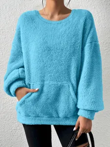 Close-up detail of women's cozy solid color plush fleece sweatshirt with front pocket.