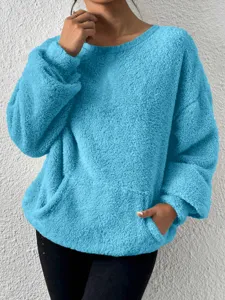 Cozy blue plush sweatshirt detail showing soft fleece texture, relaxed fit and front pocket.