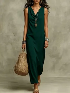 Green sleeveless maxi dress detail, elegant cowl neck design, loose comfortable fit look.