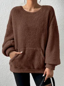 Women casual solid color long sleeve fleece sweatshirt pullover with front pocket detail.