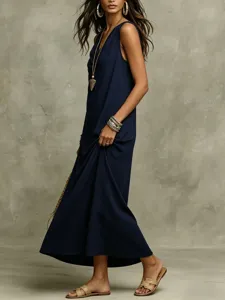 Detail view of a stylish dark blue sleeveless maxi slip dress featuring elegant drape.