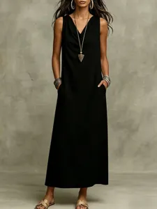 Detail shot of a black sleeveless maxi dress, casual summer loose tank dress style.