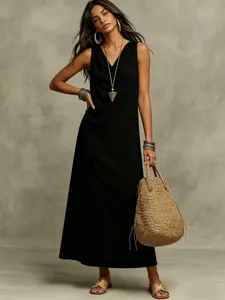 Detail view of women's casual sleeveless loose black maxi dress, elegant summer fashion wear.