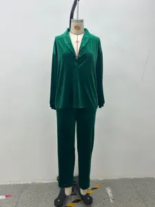 Green velvet loungewear set detail showcasing soft fabric, lapel collar and long sleeves.