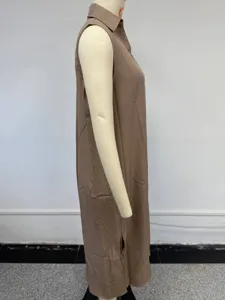 Side view detail of a casual sleeveless V-neck midi shirt dress, loose fit style.