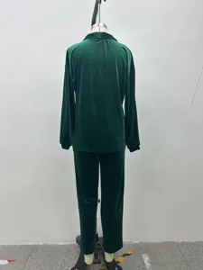 Green velvet long sleeve pants set detail view, soft fabric winter casual apparel lounge wear.