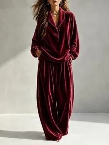 Stylish women's velvet loungewear set, long sleeve collared top and wide leg pants detail.