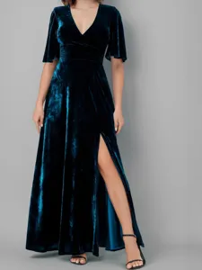 Stunning dark blue velvet V-neck maxi dress with stylish high slit for elegant evening wear.