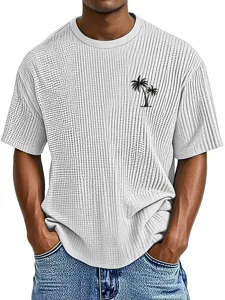 Close-up detail of the waffle knit fabric and tropical palm tree chest print on the shirt.