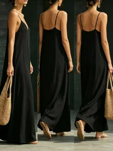 Detail view of the elegant black maxi dress featuring a V-neck and delicate straps.