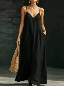 Summer solid color V-neck spaghetti strap maxi dress detail view showing loose hem design.