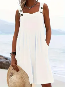 Casual white sleeveless overall dress detail showing buttons and relaxed loose fit style.