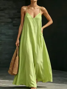 Green maxi dress detail, sleeveless V-neck style, lightweight summer resort wear apparel.