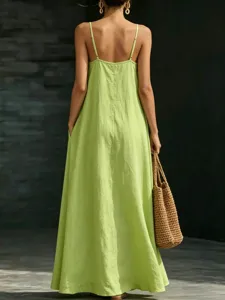 Back view of a solid lime green summer spaghetti strap long dress with a relaxed flowy hem line.