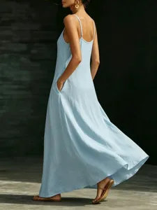 Back view detail of light blue sleeveless maxi dress with thin straps and side pockets.