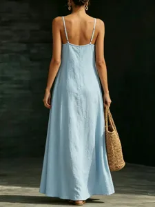 Light blue camisole maxi dress back view, elegant summer casual long dress with woven bag.
