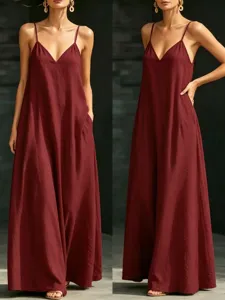 Close-up details of the elegant deep red V-neck spaghetti strap maxi dress with side pockets.