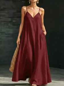 Burgundy v-neck spaghetti strap maxi dress detail, flowing design with pockets for summer.