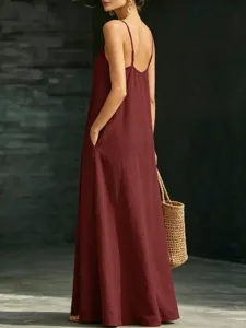 Women's summer V-neck spaghetti strap maxi casual solid color dress with side pockets.