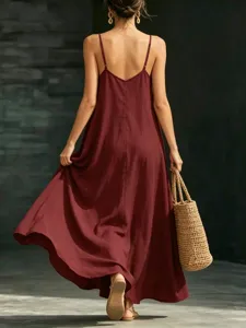 Elegant maroon spaghetti strap maxi dress for women, chic summer long dress with flowy hem.