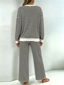 Black and white striped long sleeve top and wide leg lounge pants set apparel detail.