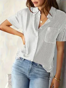 Close-up detail of women's vertical striped short sleeve shirt with button front design.